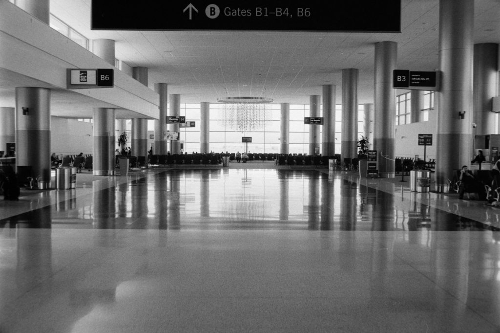 Spacious airport terminal with large windows and seating area
